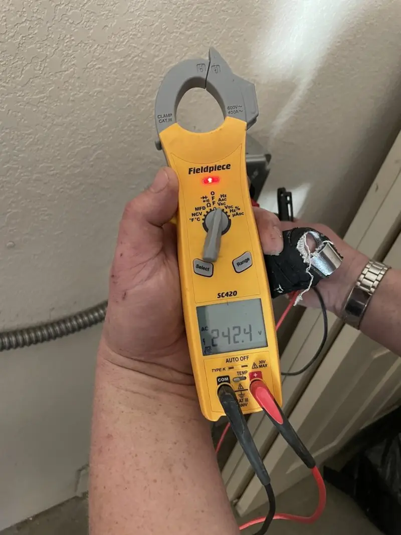 Voltage testing with clamp meter during Aluminum Wiring Replacement in Fort Polk South